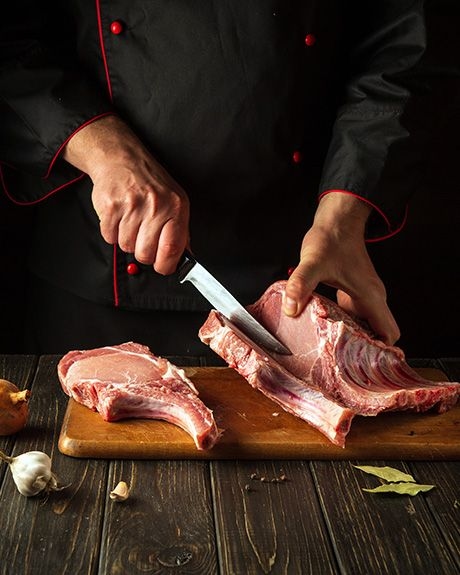 Man cutting meat
